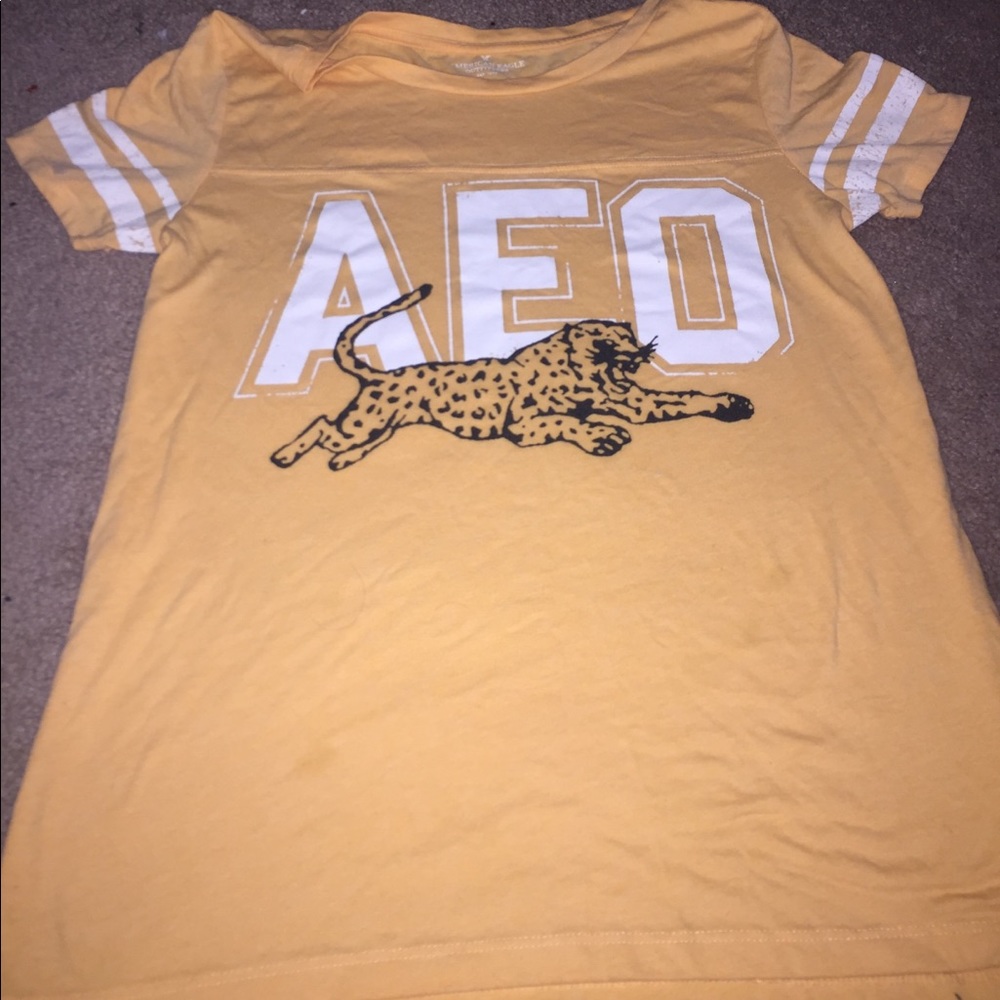 a orange shirt with a black cheetah