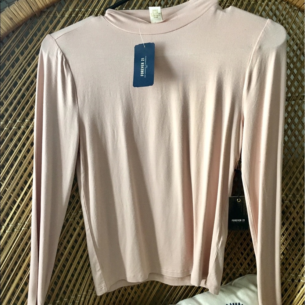 Light pink, long sleeve shirt.