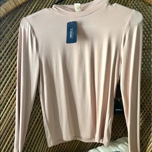 Light pink, long sleeve shirt.