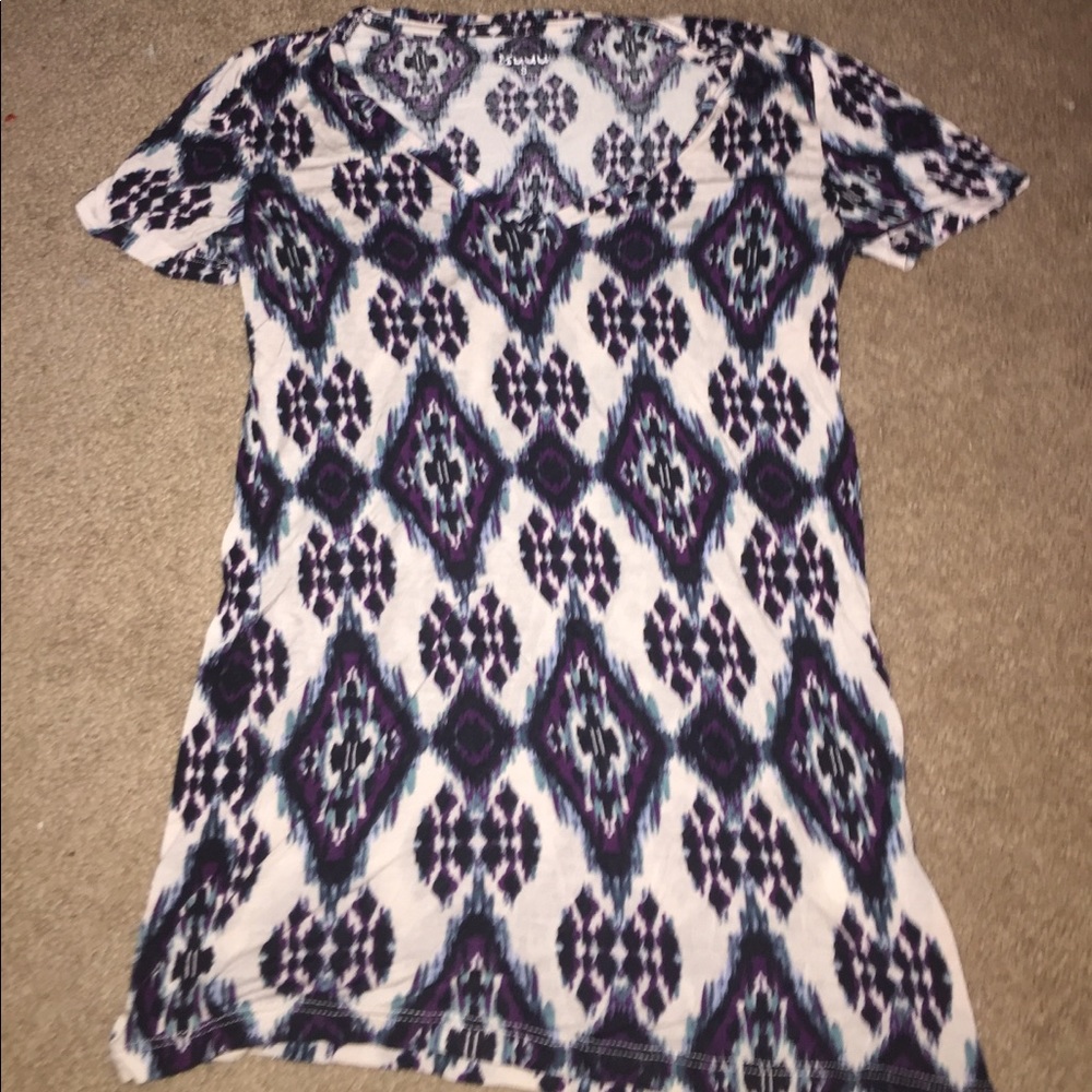 a white short sleeve with purple and blue designs