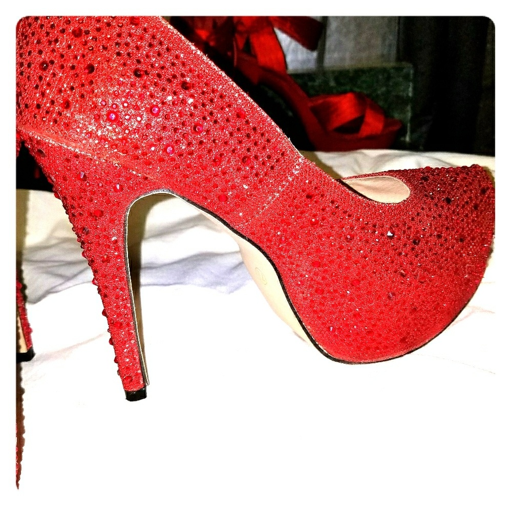 Red glittered size 7 spiked heels