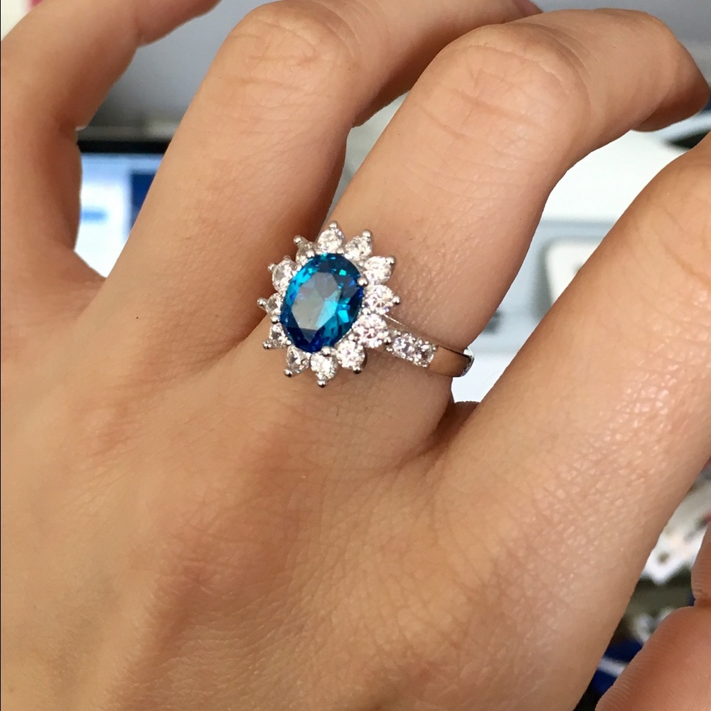 Blue topaz and white sapphire ring