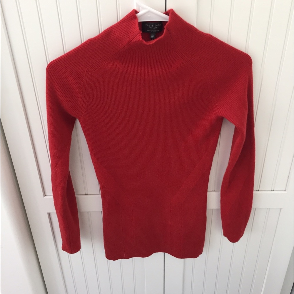 Fitted red rag & born sweater. Never worn.