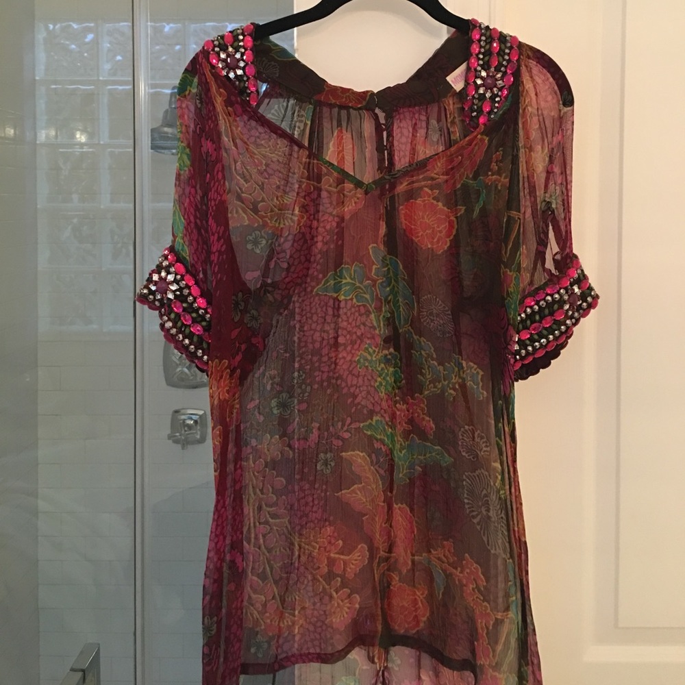 Sheer tunic top with rhinestone detail.