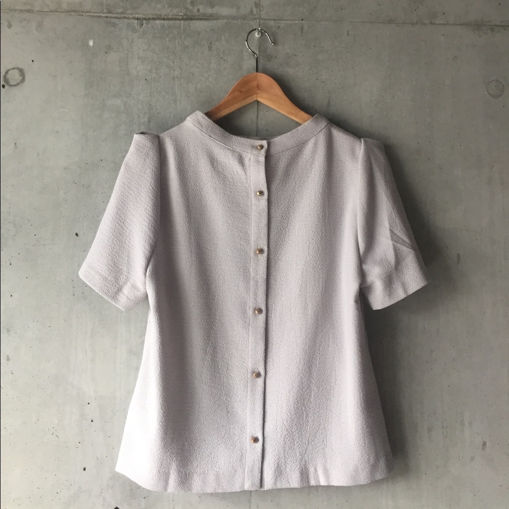 Pale gray top with gold button back