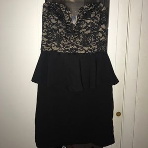 Peplum Dress. Zippers up the back.