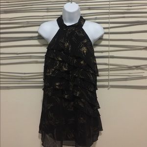 B wear. Black ruffled blouse.