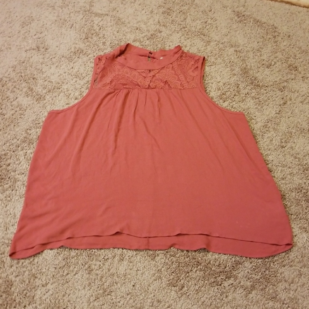 Burnt orange mock neck blouse.