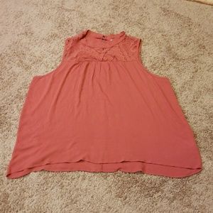 Burnt orange mock neck blouse.