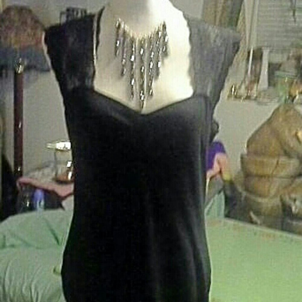 Form fitting dress black and stretchy.