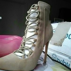 Lace up high heeled booties