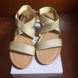 Call it Spring gold strappy sandals