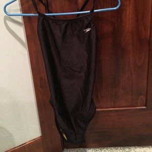 Reversible black and yellow one piece swim suit.