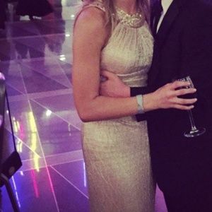 Gold halter gown with beading around the neck