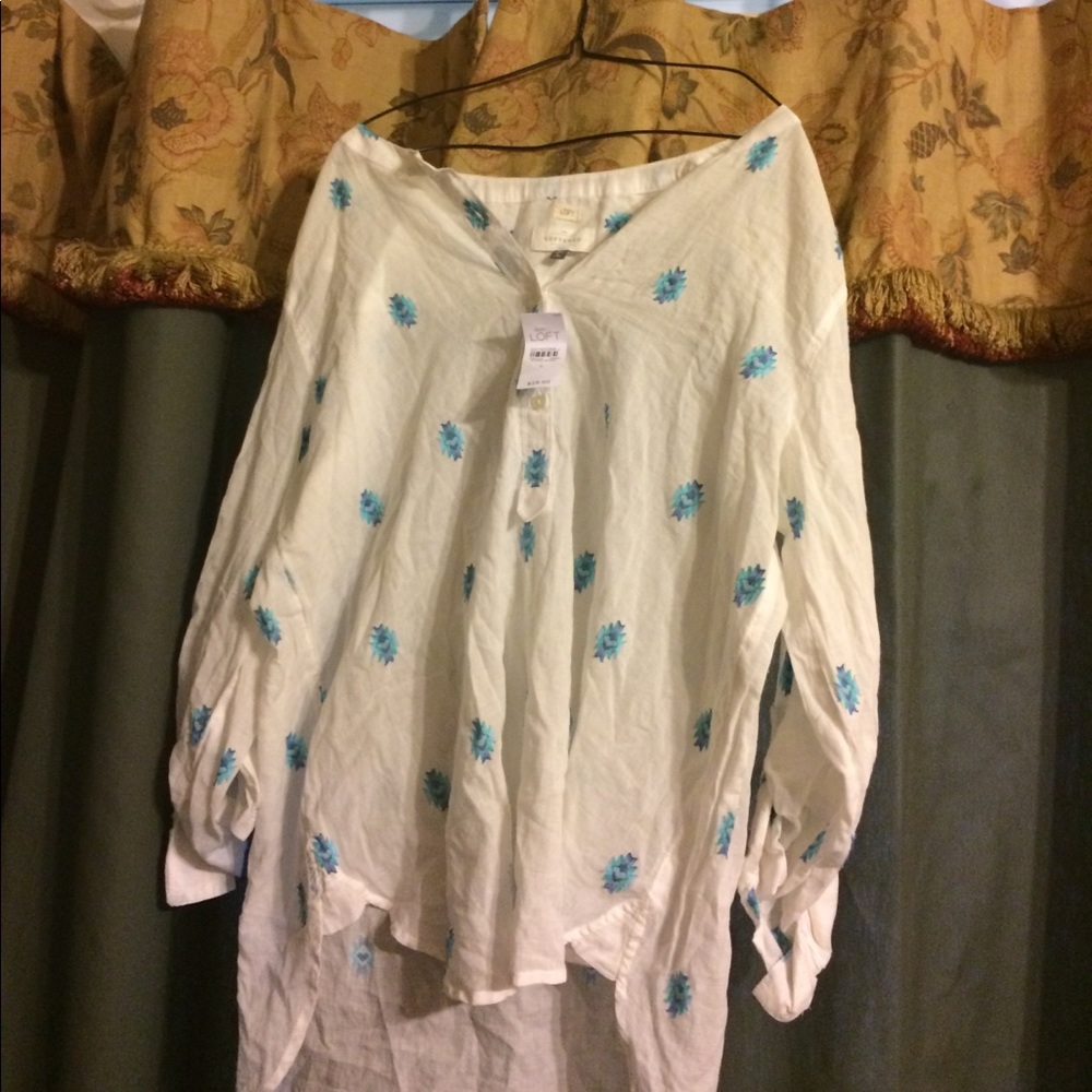 White blouse with hues of blue accents, breezy