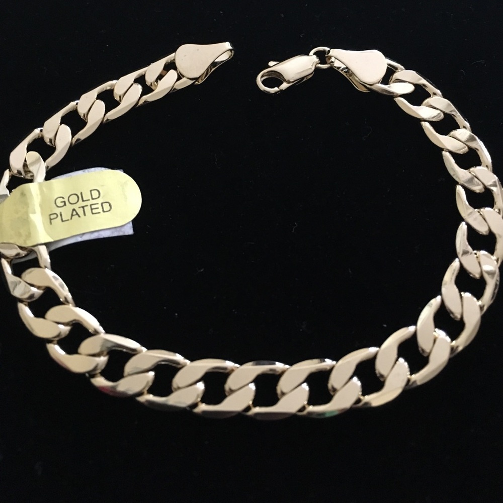 New gold plated bracelet 8" long. Width 7 mm.