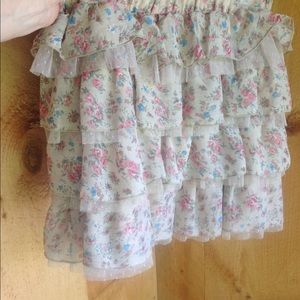 Cute lacy frilly above the knee mini skirt.