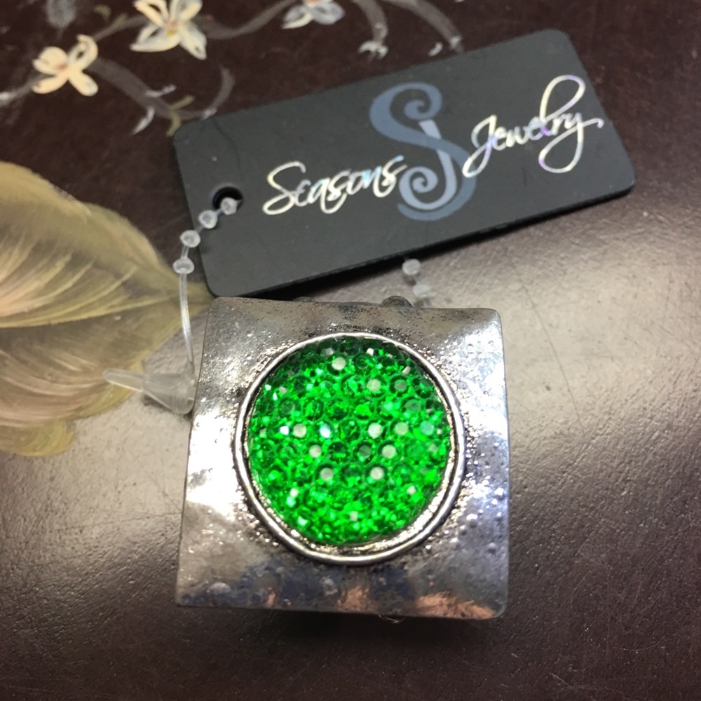 Ring Stretches to fit.  Square with Green Center