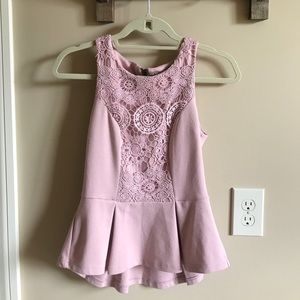 Pink peplum top with crochet detail and zipper