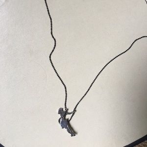 Girl swinging necklace
