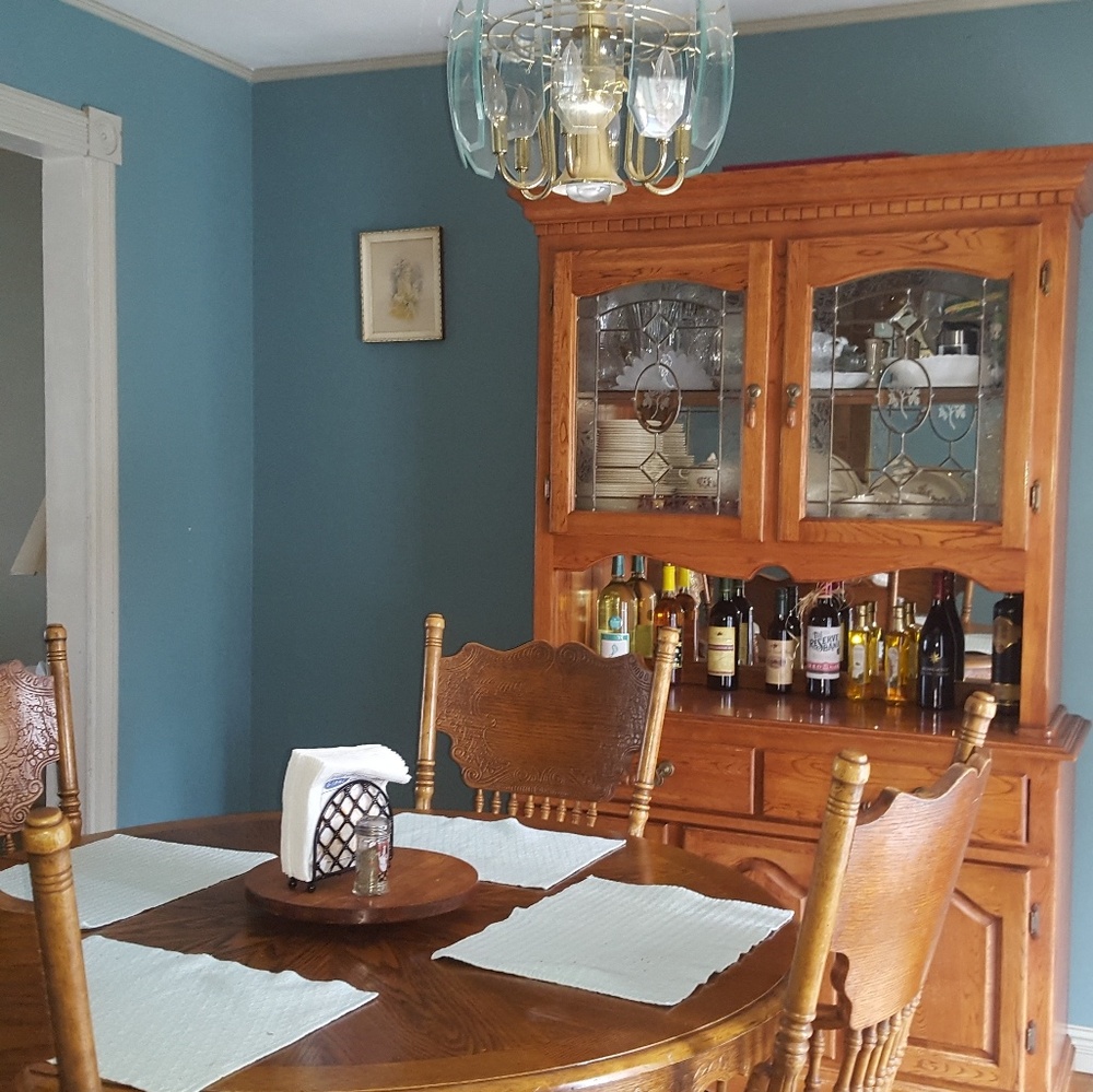 Dining room table, lighted hutch