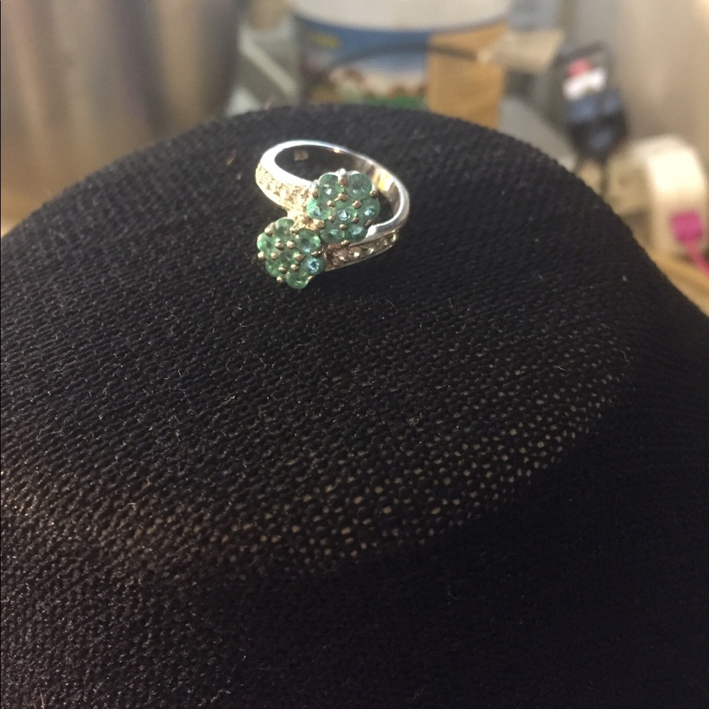 Beautiful rhodium blue cz floral ring.