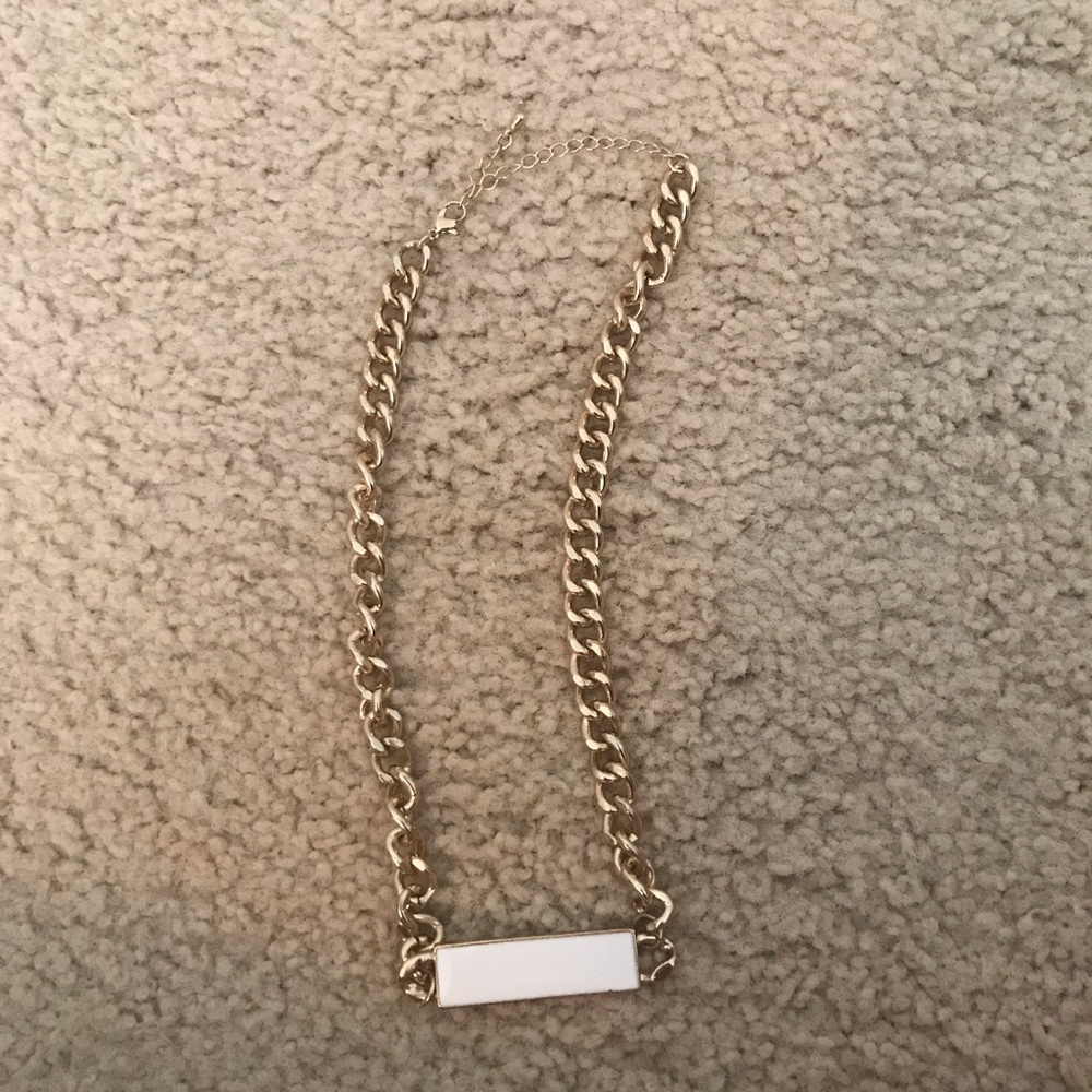 Gold necklace with white bar