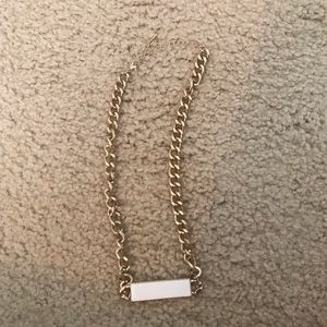 Gold necklace with white bar