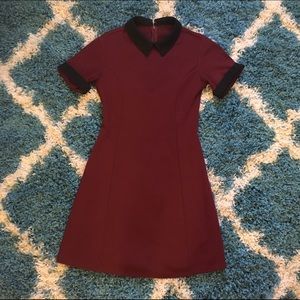 Striking black and red dress with a classic collar