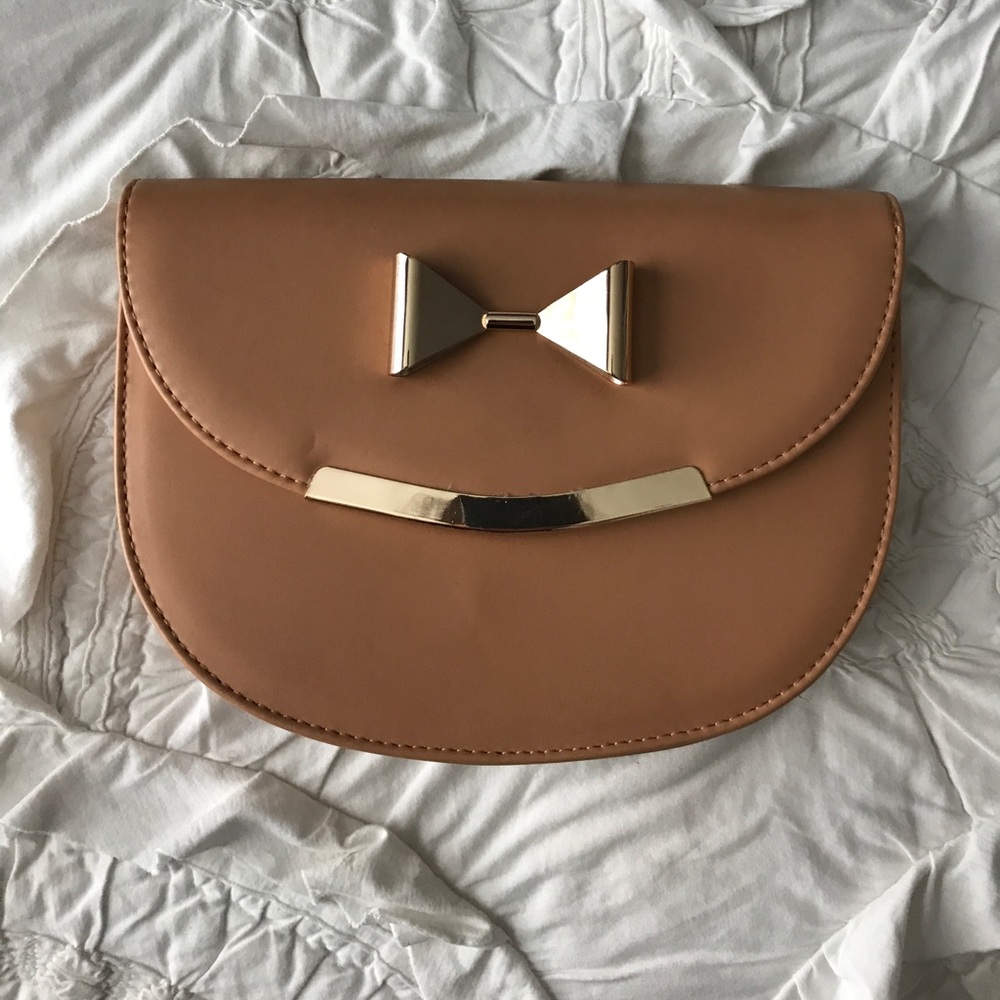 Tan clutch bag with gold accents!
