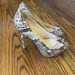 ENZO ANGIOLINI: snake skin peep toe pumps