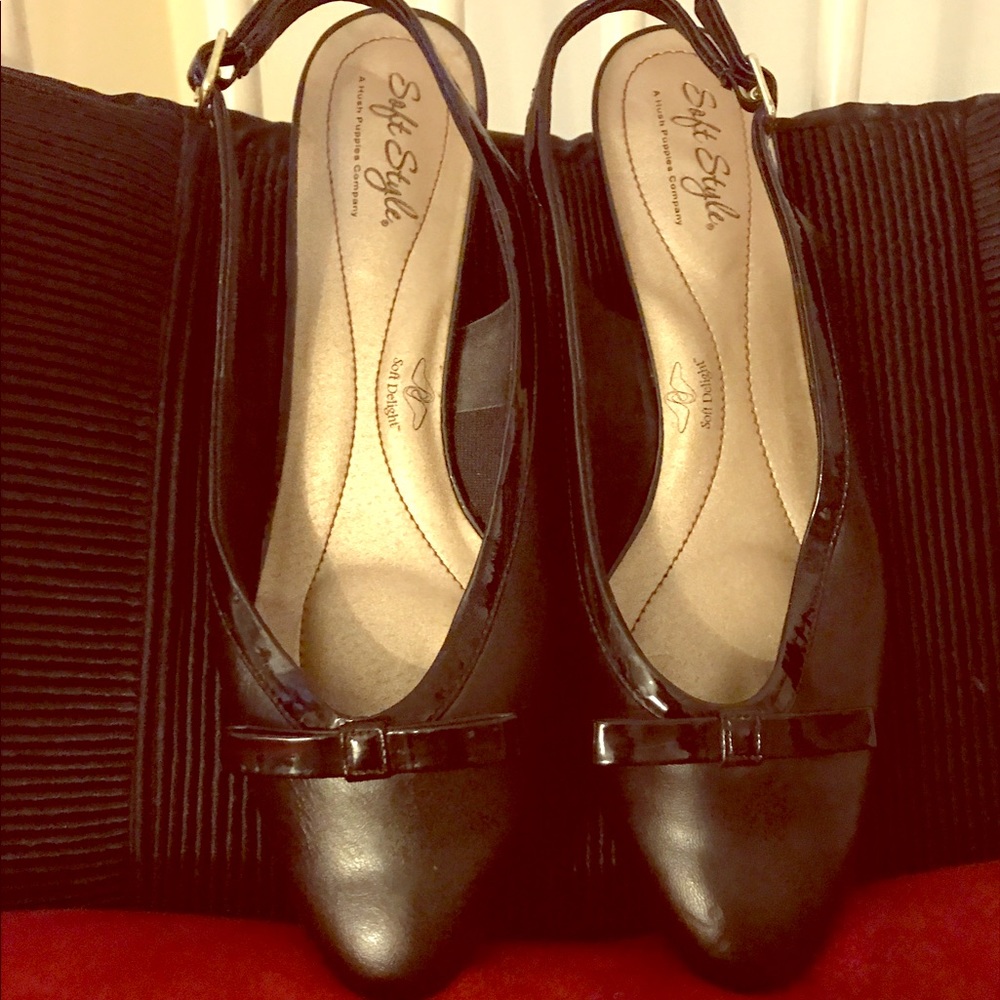 Black leather sling back low heel.