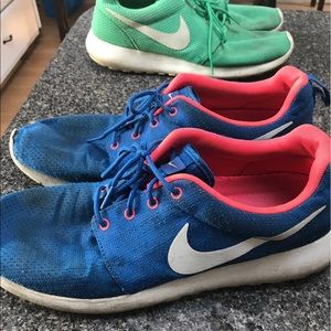 Two pairs of Nike Roshes; worn