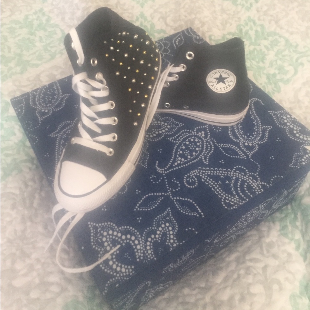 Black high top Converse with studs
