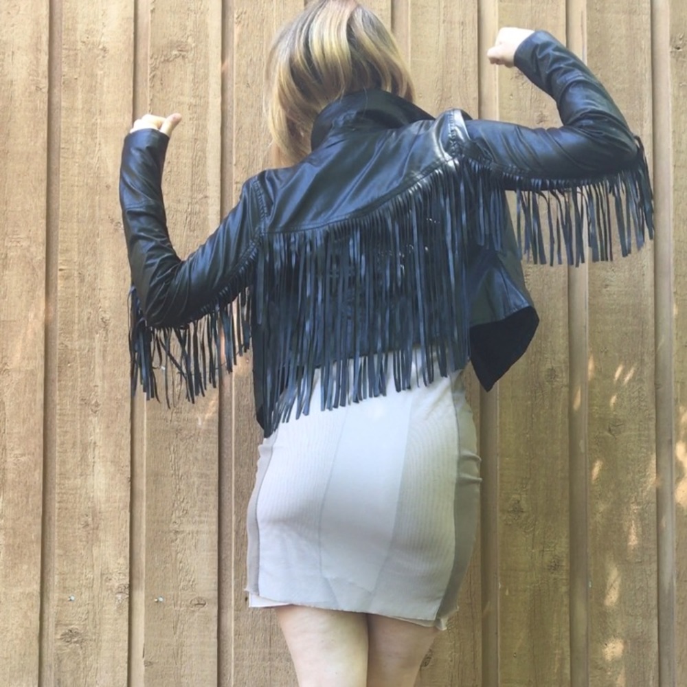 Black faux leather cropped biker jacket w/ fringe