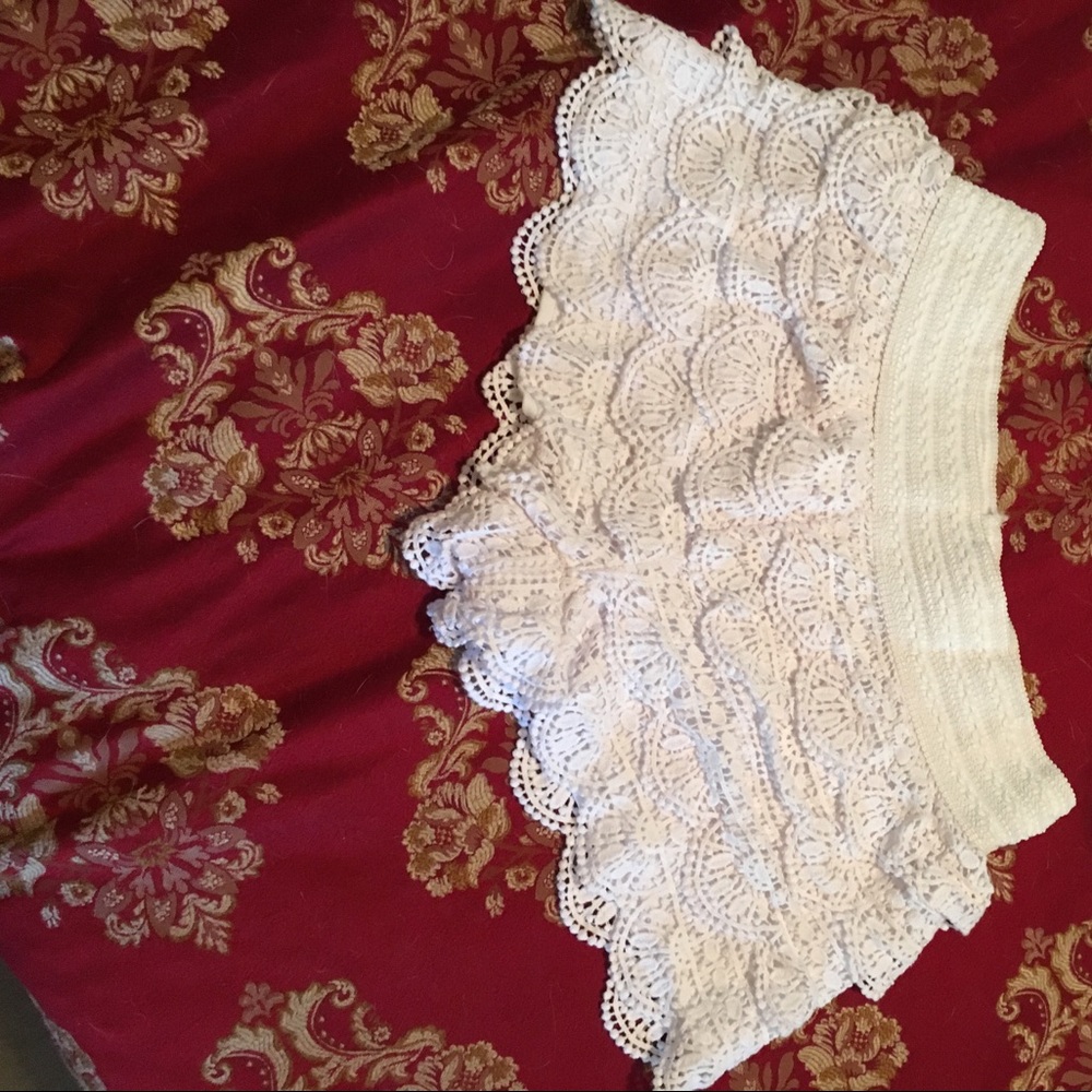 front and back view of white lace shorts