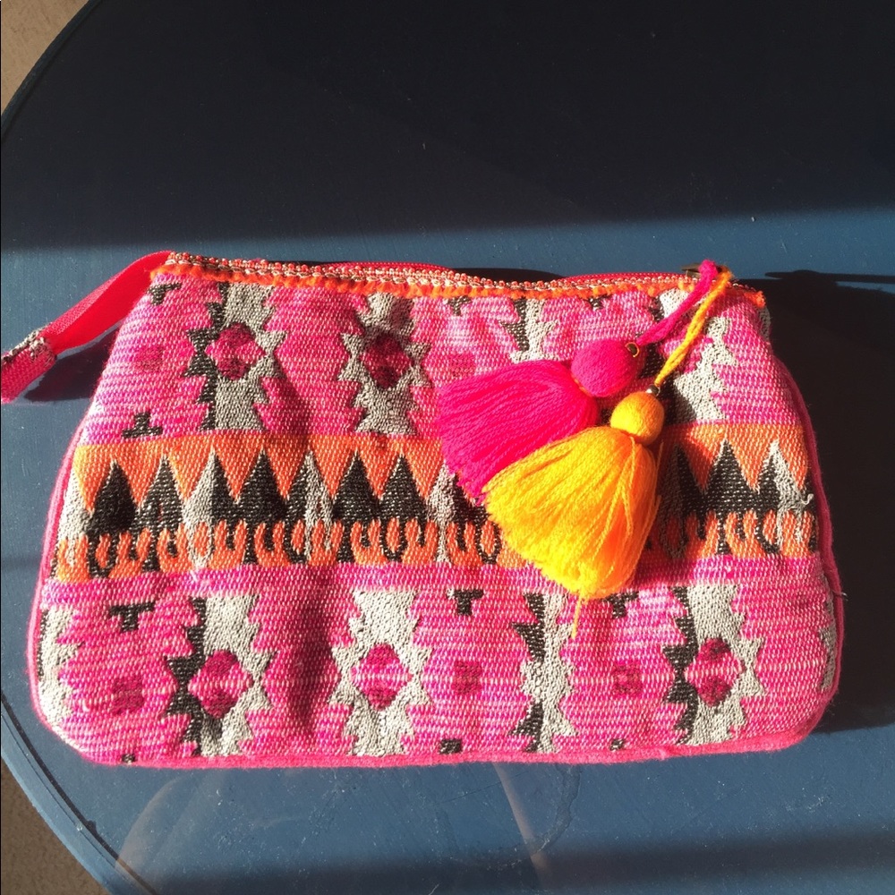 Hot pink tassel clutch