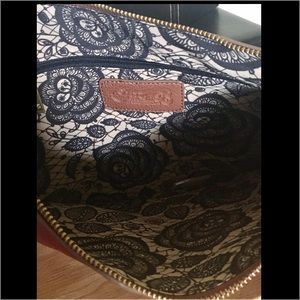 Carlos Santana Aquarius large clutch.