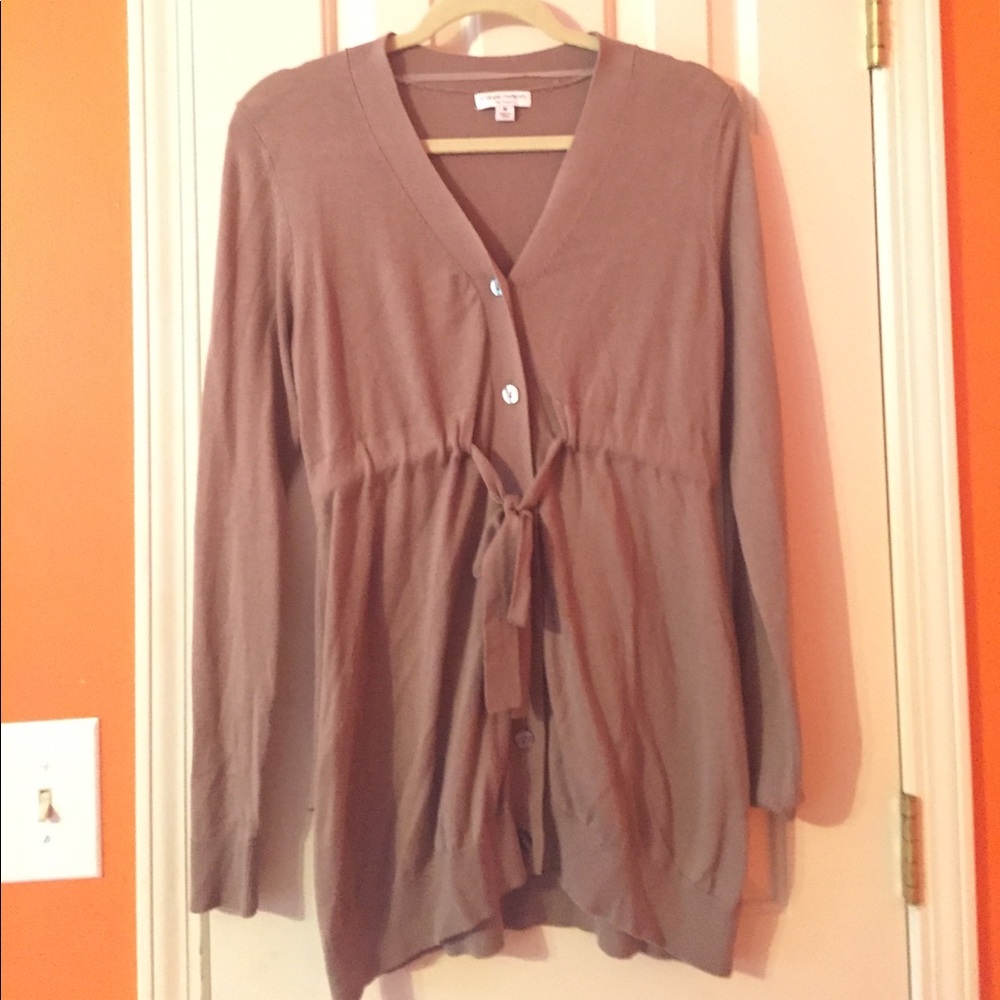 Button down sweater with waist tie.