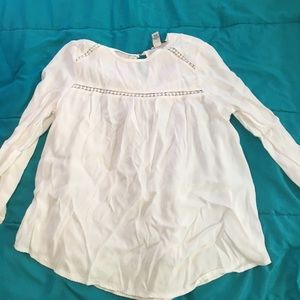 White blouse with dot cut outs