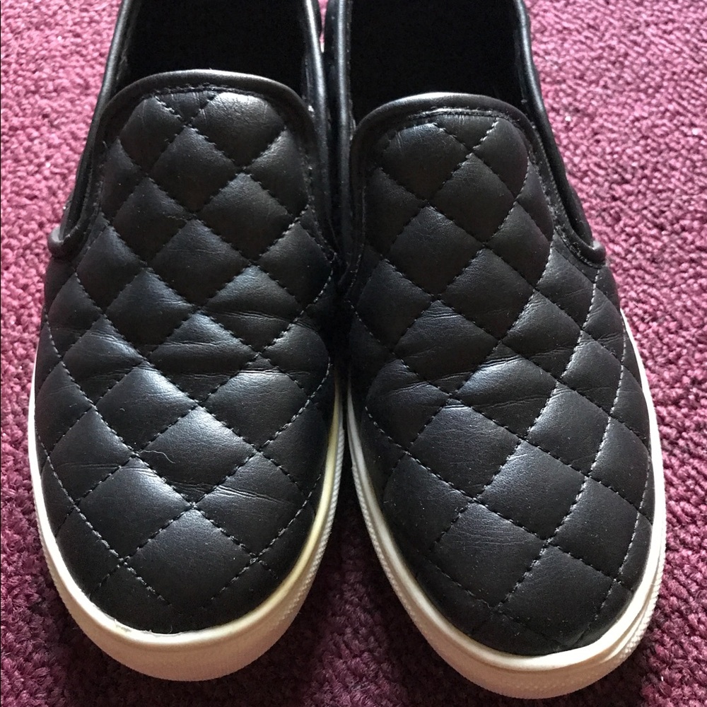 Black quilted slip ons