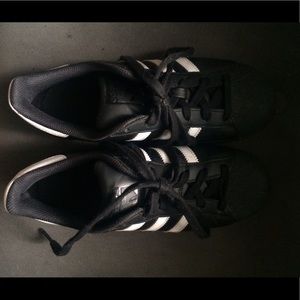Black and white Adidas Superstars
