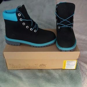 Black and turquoise Timberland boots