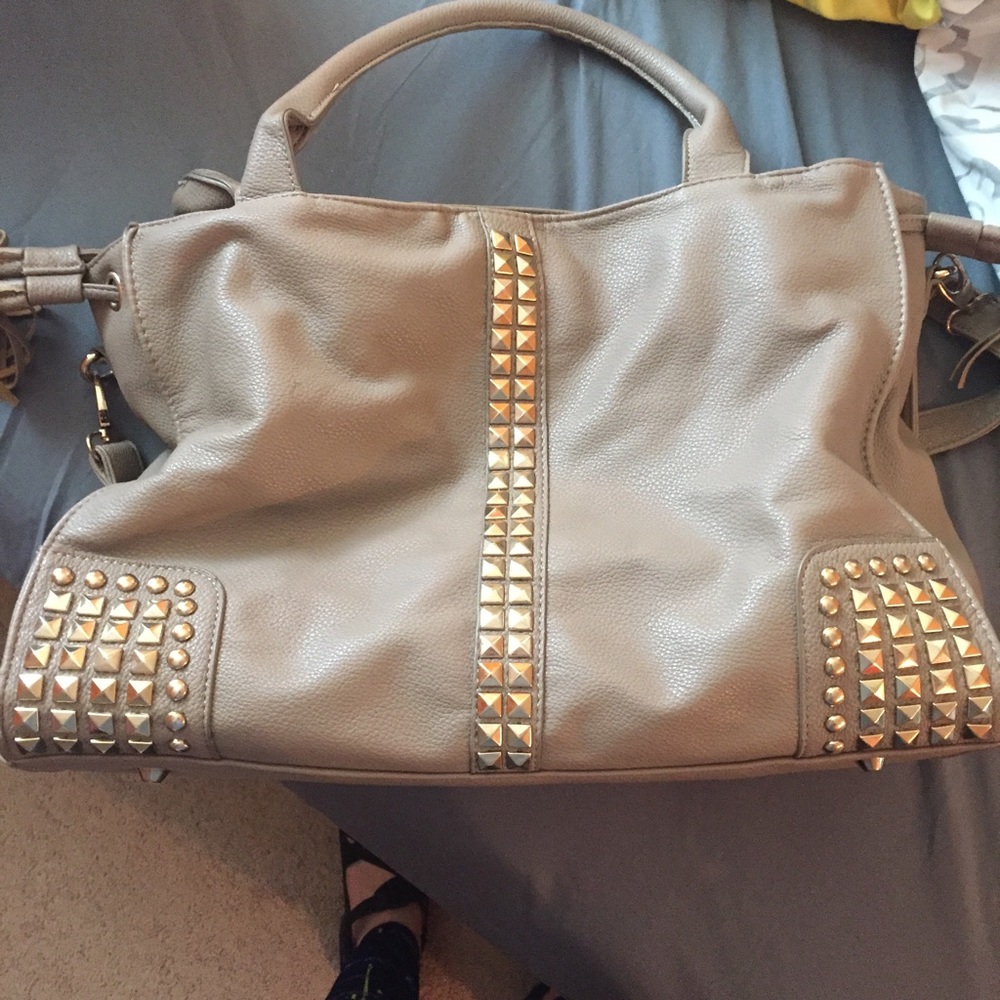 Beige studded handbag/purse.