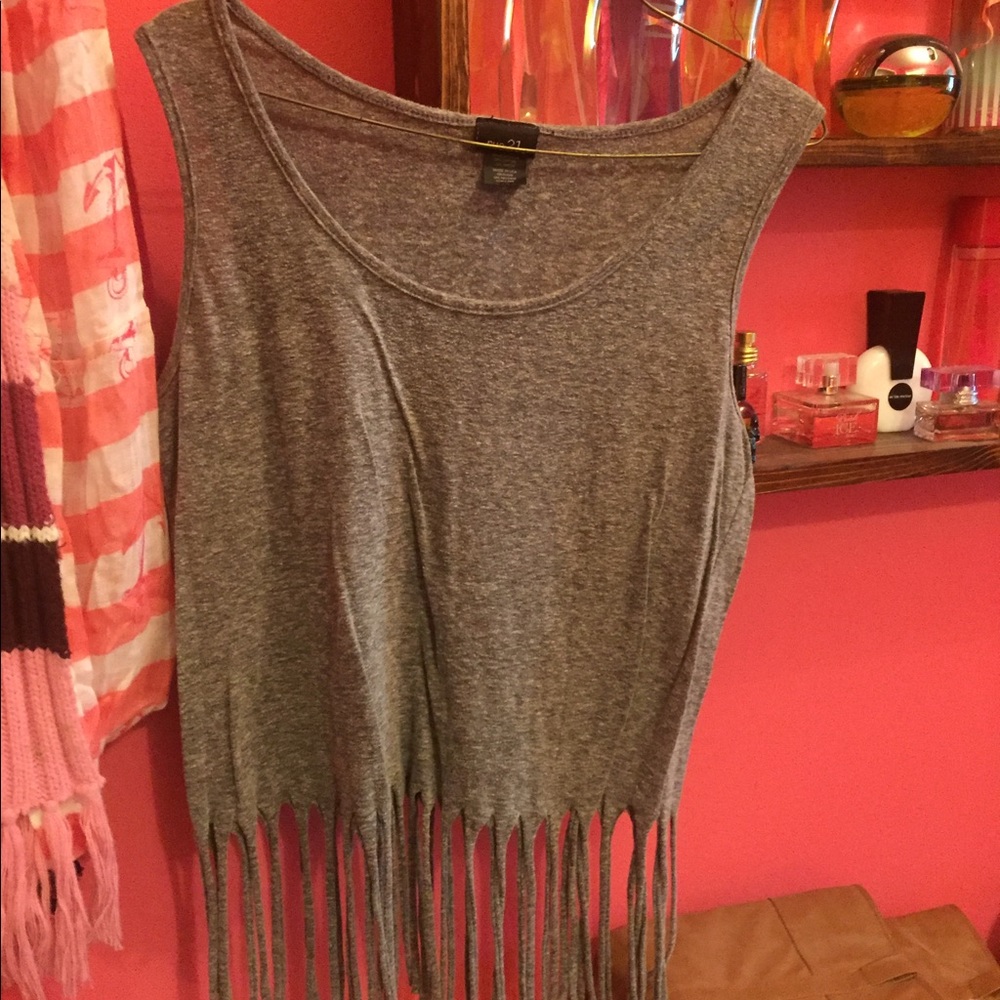 Large, grey frayed tank.