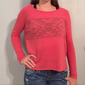 Long sleeve poly-blend, coral/pink shirt.