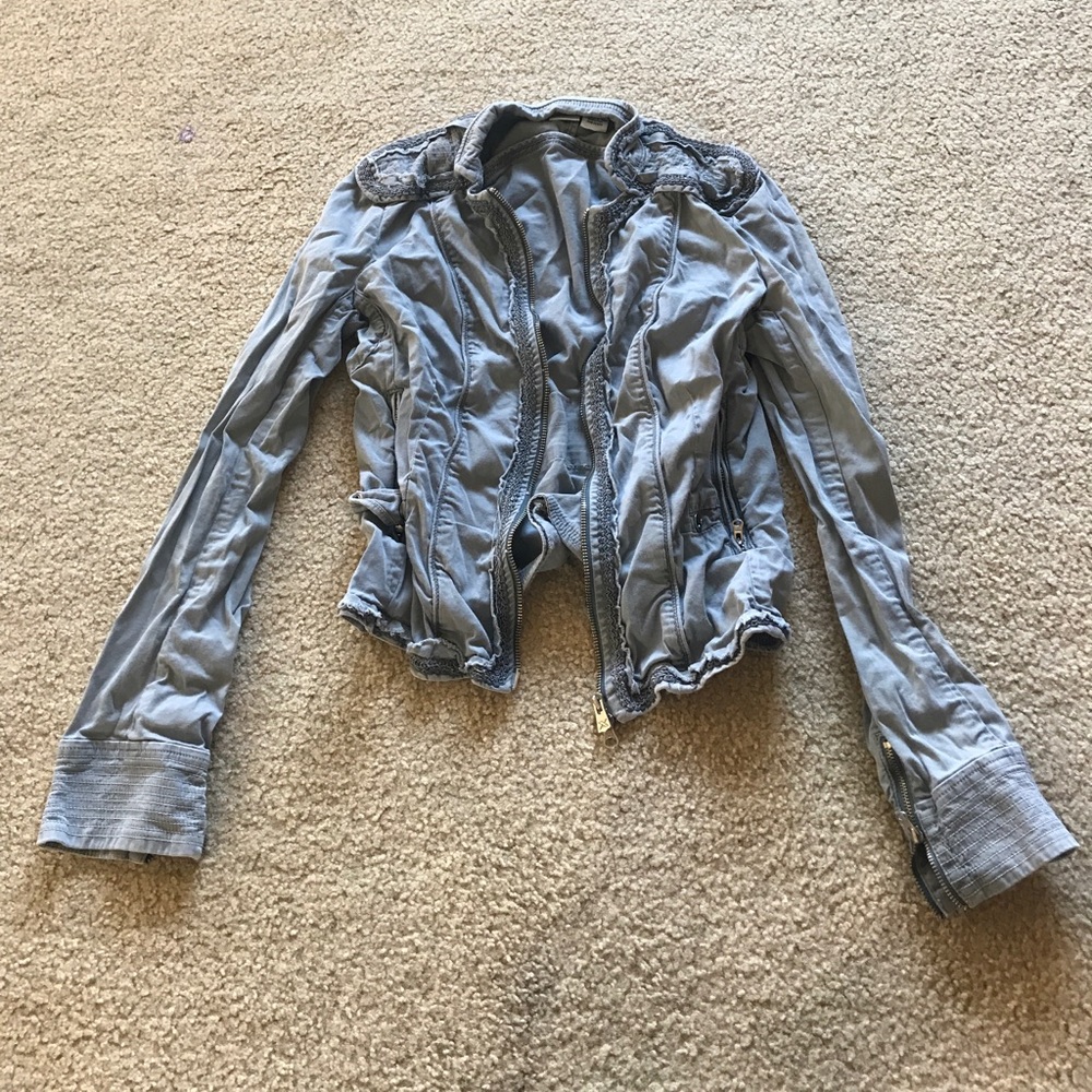 Gray jacket with zippers and buttons