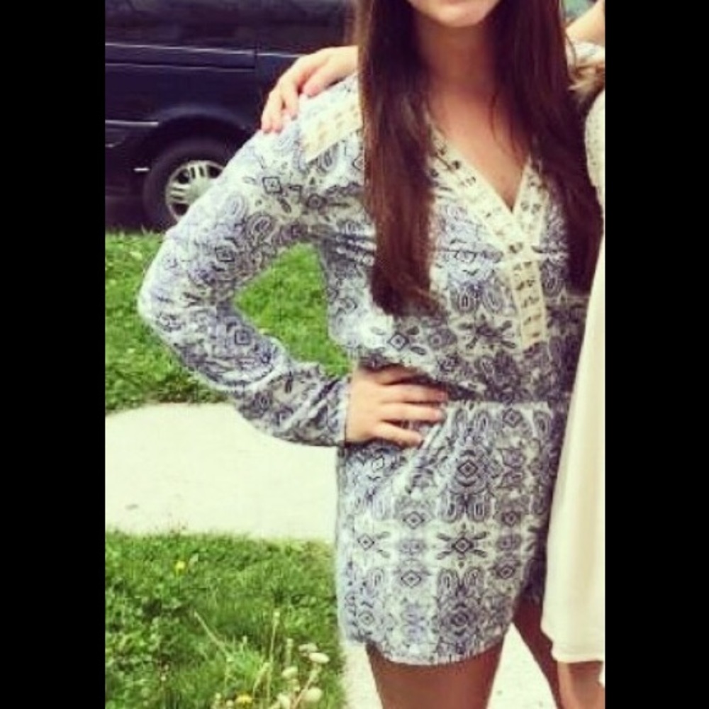 Blue and cream designed long sleeved romper.