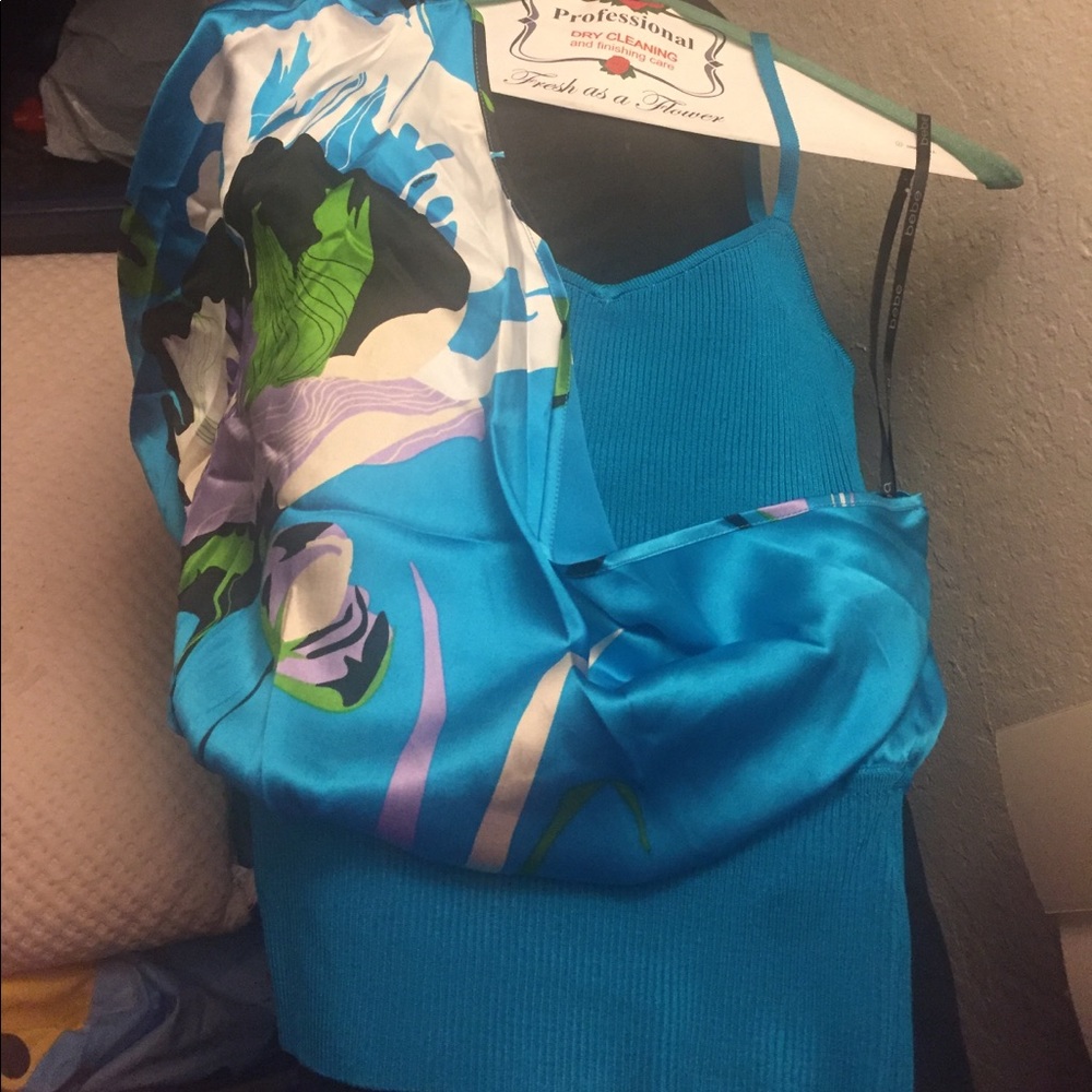 Adorable Bebe Lrg dressy tank. Fits like medium.