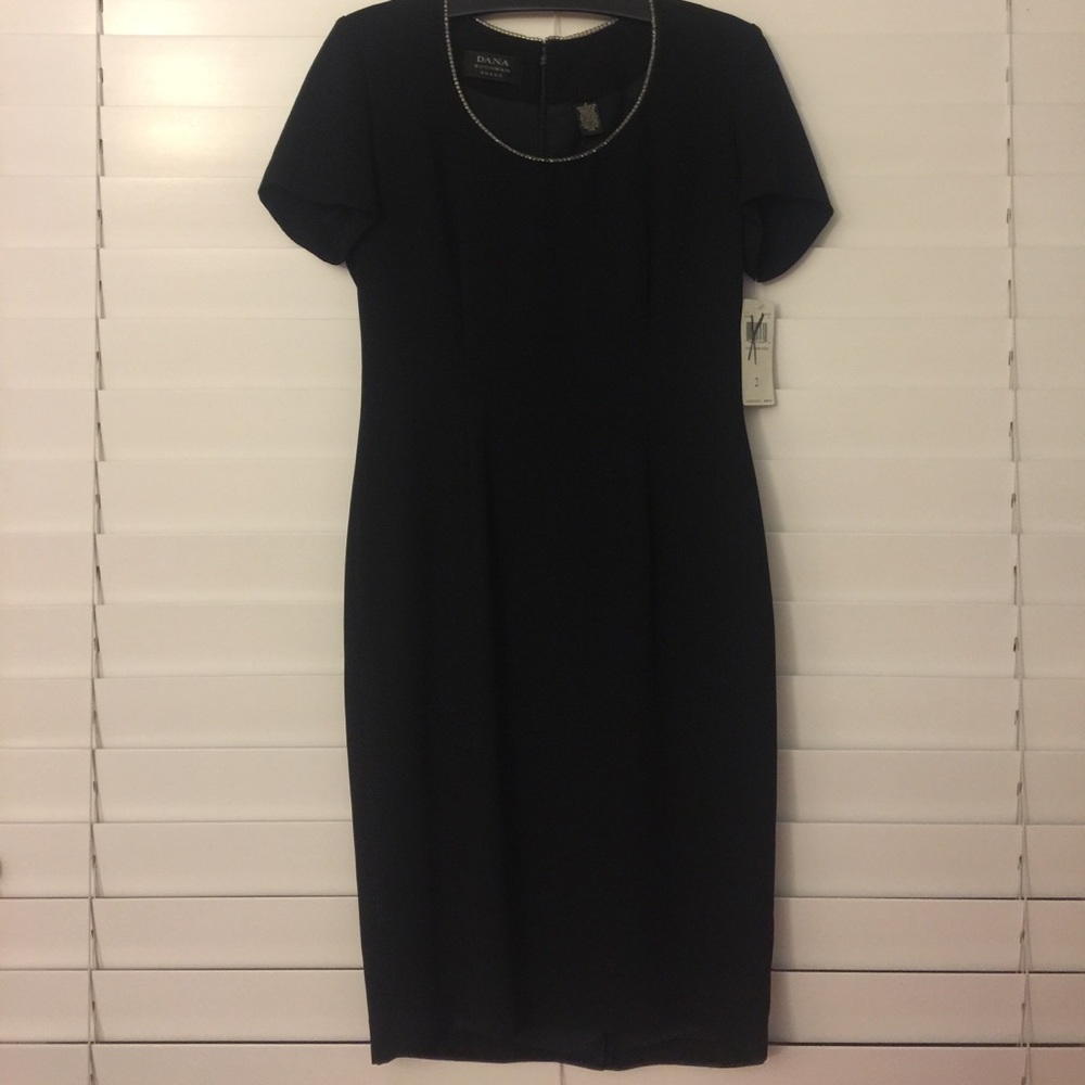 NWT Gorgeous little black dress with neckline